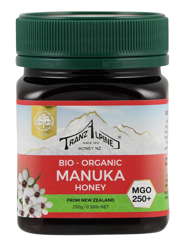 Ein Glas Bio-Manuka-Honig von TranzAlpine mit grünem Deckel, 250g, MGO 250+, aus Neuseeland.