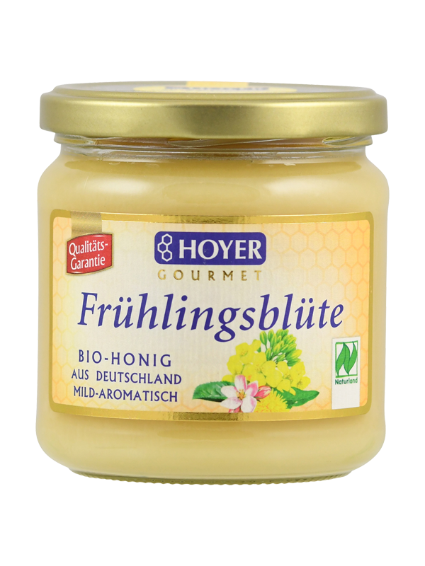 Ein Glas Hoyer Gourmet Frühlingsblüte Bio-Honig, mild-aromatisch, aus Deutschland, mit Naturland-Siegel.
