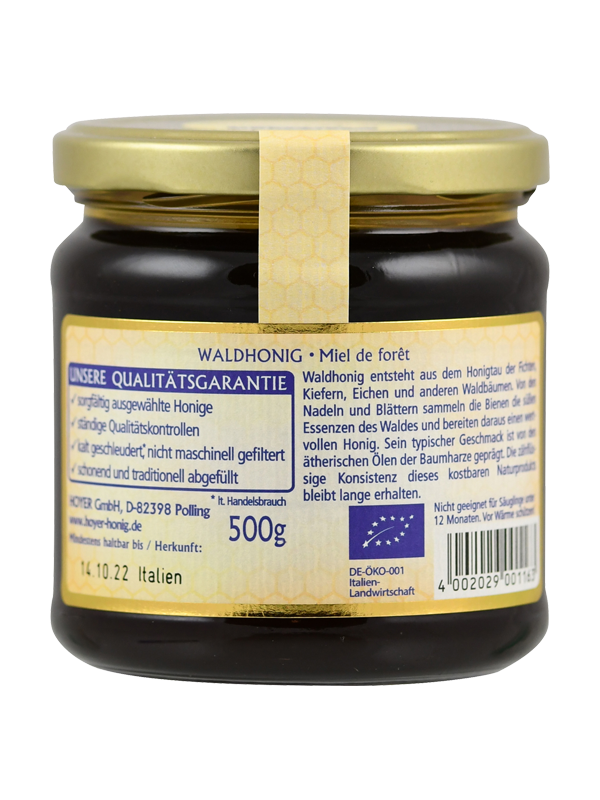 Ein Glas Waldhonig mit Etikett in Deutsch und Französisch, 500g, Herkunft Italien, Bio-Zertifikat, Qualitätsgarantie, geeignet für Säuglinge ab 12 Monaten.