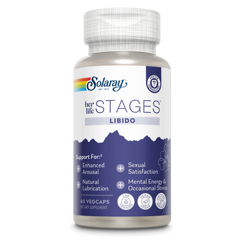 Das Bild zeigt eine weiße Plastikflasche mit einem Schraubverschluss. Auf dem Etikett steht 'Solaray Her Life Stages Libido'. Die Flasche enthält 60 VegCaps. Das Etikett hebt die Vorteile wie 'Enhanced Arousal', 'Sexual Satisfaction', 'Natural Lubrication' und 'Mental Energy & Occasional Stress' hervor. Das Produkt ist vegan und laborgeprüft. Das Design ist in Blau und Weiß gehalten.