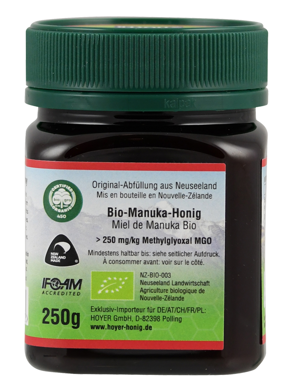 Ein Glas Bio-Manuka-Honig, 250g, aus Neuseeland, mit über 250 mg/kg Methylglyoxal MGO. Zertifizierungen und Importinformationen sind sichtbar.