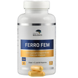 Das Bild zeigt eine weiße Plastikflasche mit dem Etikett 'FERRO FEM' von American Biologics. Die Flasche enthält 90 Kapseln eines Nahrungsergänzungsmittels mit Eisen, Vitamin C und B-Vitaminen. Auf dem Etikett sind die Begriffe 'VEGAN' und 'NON GMO' zu sehen. Vor der Flasche liegen zwei gelbe Kapseln.
