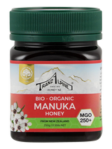 Ein Glas Bio-Manuka-Honig von TranzAlpine mit grünem Deckel, 250g, MGO 250+, aus Neuseeland.