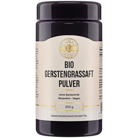 Ein schwarzes Kunststoffbehälter mit einem weißen Etikett, das "Bio Gerstengrassaft Pulver" in schwarzer Schrift zeigt. Das Etikett enthält auch Informationen wie "ohne Gentechnik", "Glutenfrei", "Vegan" und "250 g". Oben auf dem Etikett befindet sich ein goldfarbenes Logo mit der Aufschrift "I LIKE IT CLEAN FOR MY HEALTH". Der Behälter ist zylindrisch und hat einen Deckel. Es handelt sich um ein Nahrungsergänzungsmittel.