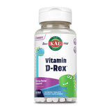 Eine Flasche mit Nahrungsergänzungsmitteln namens "Vitamin D-Rex" von der Marke KAL. Auf dem Etikett sind zwei cartoonartige Dinosaurier abgebildet, einer blau und einer grün. Die Flasche enthält 120 Mikrotabletten mit Wassermelonengeschmack zur Unterstützung der Knochengesundheit. Das Etikett weist auch auf die "ActivMelt"-Technologie hin.