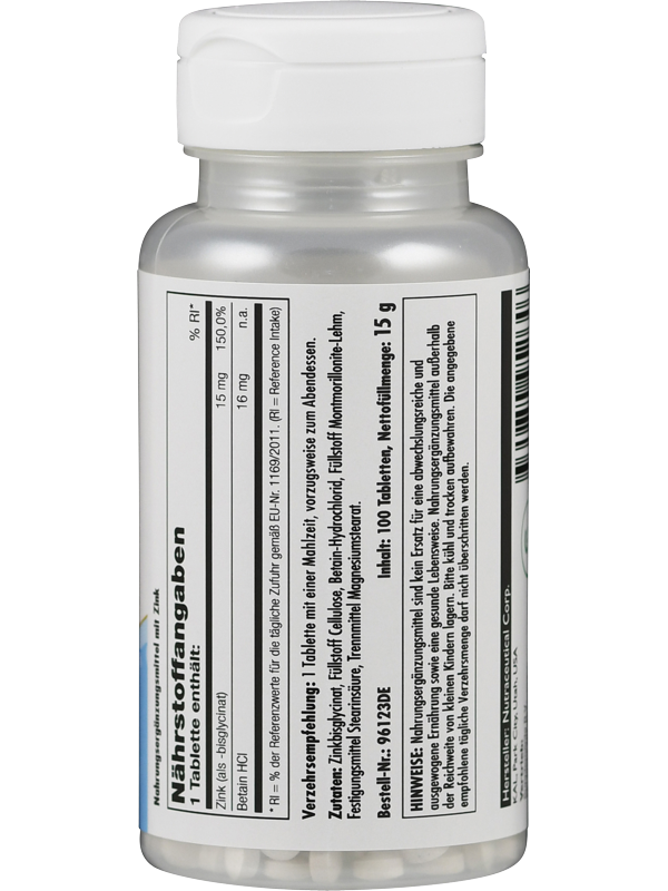 Das Bild zeigt eine weiße Plastikflasche mit einem weißen Schraubverschluss. Auf der Flasche befindet sich ein Etikett mit Nährstoffinformationen und einer Zutatenliste. Die Schrift ist schwarz auf weißem Hintergrund. Auf der rechten Seite befindet sich ein Barcode. Die Flasche steht aufrecht vor einem neutralen Hintergrund.
