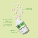 Offene Flasche mit weißen Kapseln auf grünem Hintergrund. Text: "Mit Inositol, Cholin, L-Glutamin, L-Taurin & Magnesium", "Vegane Kapseln", "1 Kapsel täglich".