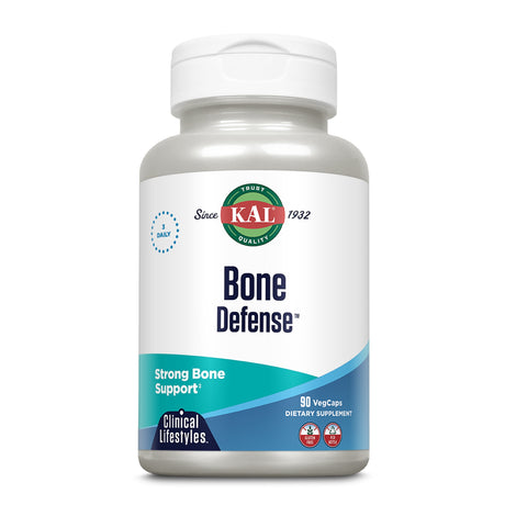 Eine weiße Plastikflasche mit einem Schraubverschluss ist abgebildet. Auf der Flasche steht "KAL Bone Defense" mit dem Hinweis auf starke Knochengesundheit. Die Flasche enthält 90 vegetarische Kapseln. Das Etikett ist in Blau und Grün gestaltet.