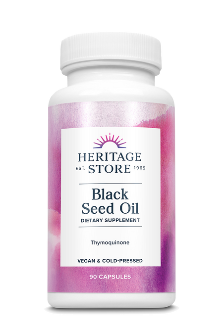 Eine weiße Plastikflasche mit einem rosa Etikett. Auf dem Etikett steht 'Heritage Store Black Seed Oil Dietary Supplement'.
