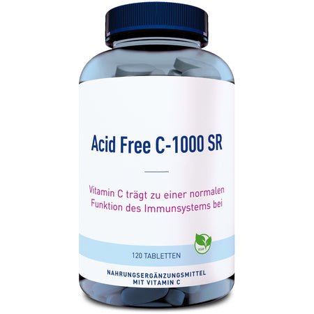 Das Bild zeigt eine blaue Plastikflasche mit einem Etikett, auf dem "Acid Free C-1000 SR" steht. Darunter befindet sich der Text "Vitamin C trägt zu einer normalen Funktion des Immunsystems bei". Die Flasche enthält 120 Tabletten und ist als Nahrungsergänzungsmittel mit Vitamin C gekennzeichnet. Ein kleines Symbol zeigt, dass das Produkt vegan ist.