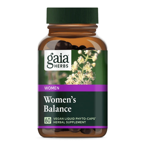 Eine braune Flasche mit einem grünen Deckel, auf der ein Etikett mit der Aufschrift 'gaia HERBS', 'WOMEN', 'Women's Balance', '60 VEGAN LIQUID PHYTO-CAPS', 'HERBAL SUPPLEMENT' zu sehen ist. Im Hintergrund sind weiße Blüten abgebildet.