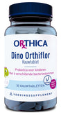 Ein transparentes Glas mit blauem Deckel enthält 30 Kautabletten. Auf dem Etikett steht 'Orthica Dino Orthiflor Kautablet' und 'Probiotica voor kinderen Met 6 verschillende bacteriestammen'. Es ist ein Nahrungsergänzungsmittel für Kinder mit vegetarischen Inhaltsstoffen und schwarzem Beerengeschmack.