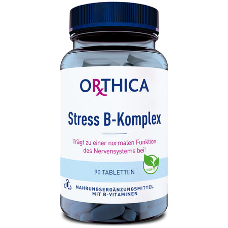 Eine Flasche mit der Aufschrift 'ORTHICA Stress B-Komplex' ist zu sehen. Die Flasche enthält 90 Tabletten und ist als Nahrungsergänzungsmittel mit B-Vitaminen gekennzeichnet. Ein grünes Symbol zeigt, dass das Produkt vegan ist.