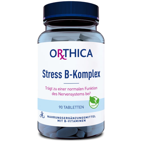 Eine Flasche mit der Aufschrift 'ORTHICA Stress B-Komplex' ist zu sehen. Die Flasche enthält 90 Tabletten und ist als Nahrungsergänzungsmittel mit B-Vitaminen gekennzeichnet. Ein grünes Symbol zeigt, dass das Produkt vegan ist.
