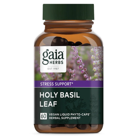 Das Bild zeigt eine Flasche mit Nahrungsergänzungsmitteln der Marke Gaia Herbs. Auf dem Etikett steht 'Holy Basil Leaf', 'Stress Support' und 'Vegan Liquid Phyto-Caps'. Die Flasche ist braun mit einem grünen Deckel und zeigt ein Bild von Basilikum.