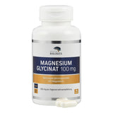Eine weiße Plastikflasche mit dem Etikett 'MAGNESIUM GLYCINAT 100 mg' von American Biologics steht vor einem weißen Hintergrund. Das Etikett zeigt Informationen über das Nahrungsergänzungsmittel, einschließlich der Dosierungsempfehlung von 200 mg pro Tag und der Anzahl der Kapseln (90 Stück). Zwei Kapseln liegen vor der Flasche.