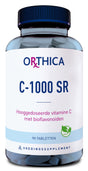 Eine Flasche mit dem Etikett 'ORTHICA C-1000 SR' ist abgebildet. Die Flasche enthält 90 Tabletten eines hochdosierten Vitamin-C-Präparats mit Bioflavonoiden. Auf dem Etikett steht 'Voedingssupplement' und es ist ein veganes Symbol zu sehen.