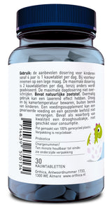 Eine Flasche mit einem blauen Deckel und weißen Etikett, das Gebrauchsanweisungen und Inhaltsstoffe in niederländischer Sprache enthält. Die Flasche enthält 30 Kautabletten. Auf dem Etikett ist ein grüner Dinosaurier abgebildet. Die Flasche ist aus recyceltem Plastik und enthält natürliche Süßstoffe.