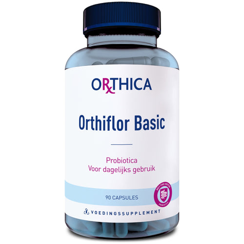 Eine blaue Plastikflasche mit weißem Etikett, auf dem "Orthica Orthiflor Basic" steht. Enthält 90 Kapseln Probiotika zur täglichen Verwendung. Das Etikett zeigt auch ein pinkfarbenes Logo und den Text "VOEDINGSSUPPLEMENT".