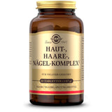 Das Bild zeigt eine braune Glasflasche mit einem goldenen Deckel. Auf dem Etikett steht "Solgar Haut-, Haare-, Nägel-Komplex". Es ist für Veganer geeignet und enthält 60 Tabletten. Die Flasche steht auf einem weißen Hintergrund.