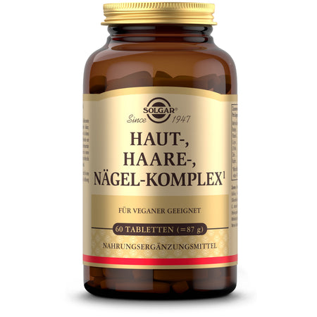 Das Bild zeigt eine braune Glasflasche mit einem goldenen Deckel. Auf dem Etikett steht "Solgar Haut-, Haare-, Nägel-Komplex". Es ist für Veganer geeignet und enthält 60 Tabletten. Die Flasche steht auf einem weißen Hintergrund.