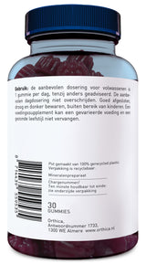 Das Bild zeigt eine Plastikflasche mit einem blauen Deckel, die mit roten Gummibärchen gefüllt ist. Auf dem Etikett steht eine Gebrauchsanweisung auf Niederländisch, die die empfohlene Dosierung und Lagerungsbedingungen beschreibt. Die Flasche enthält 30 Gummibärchen und ist aus 100% recyceltem Plastik gefertigt. Ein Barcode und die Adresse des Herstellers in Almere, Niederlande, sind ebenfalls sichtbar.