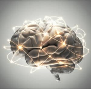 Gehirn mit Darstellung von Nervenimpulsen und Vernetzung